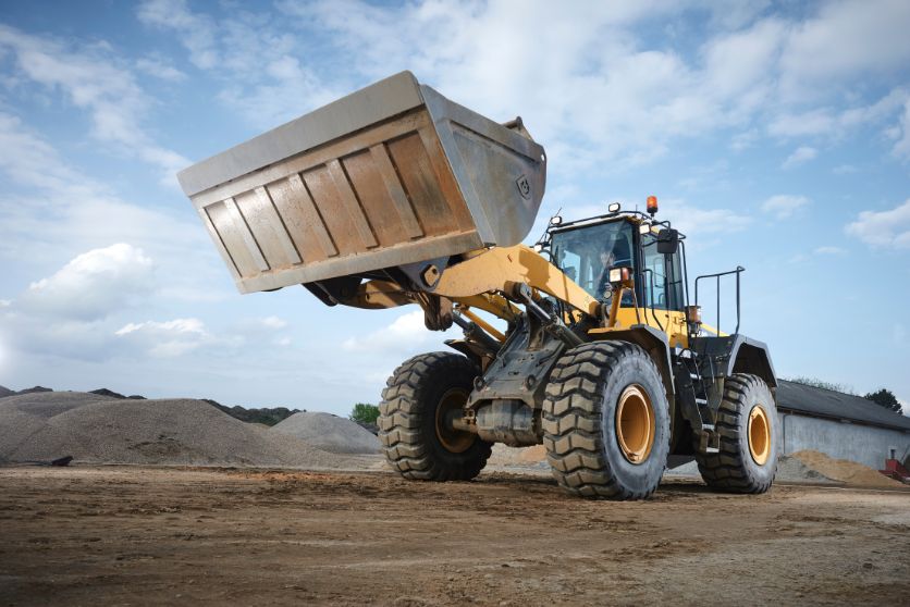 The image features a bulldozer in a construction zone, representing an article on accidents involving heavy machinery.